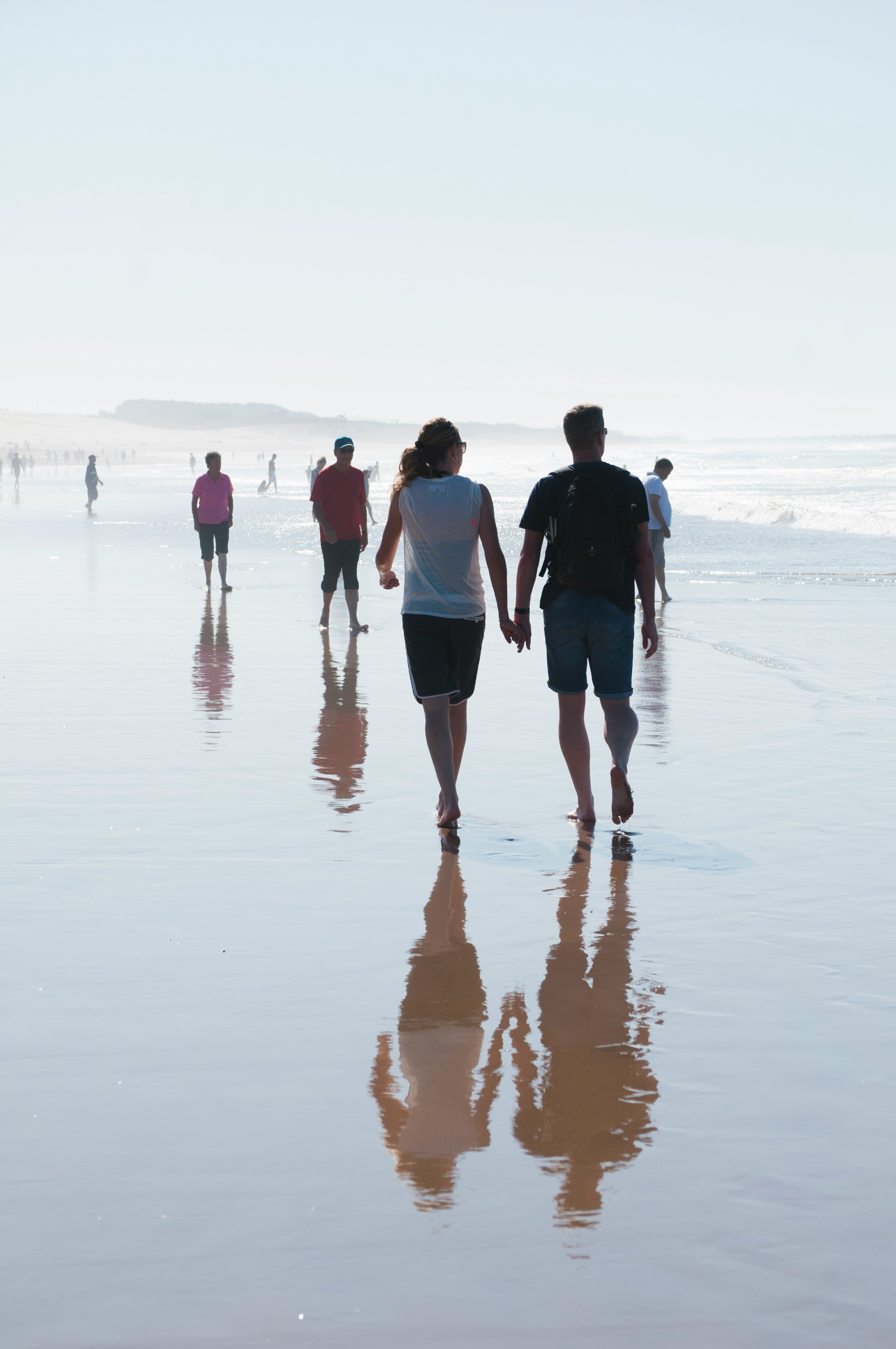 people walking on beach